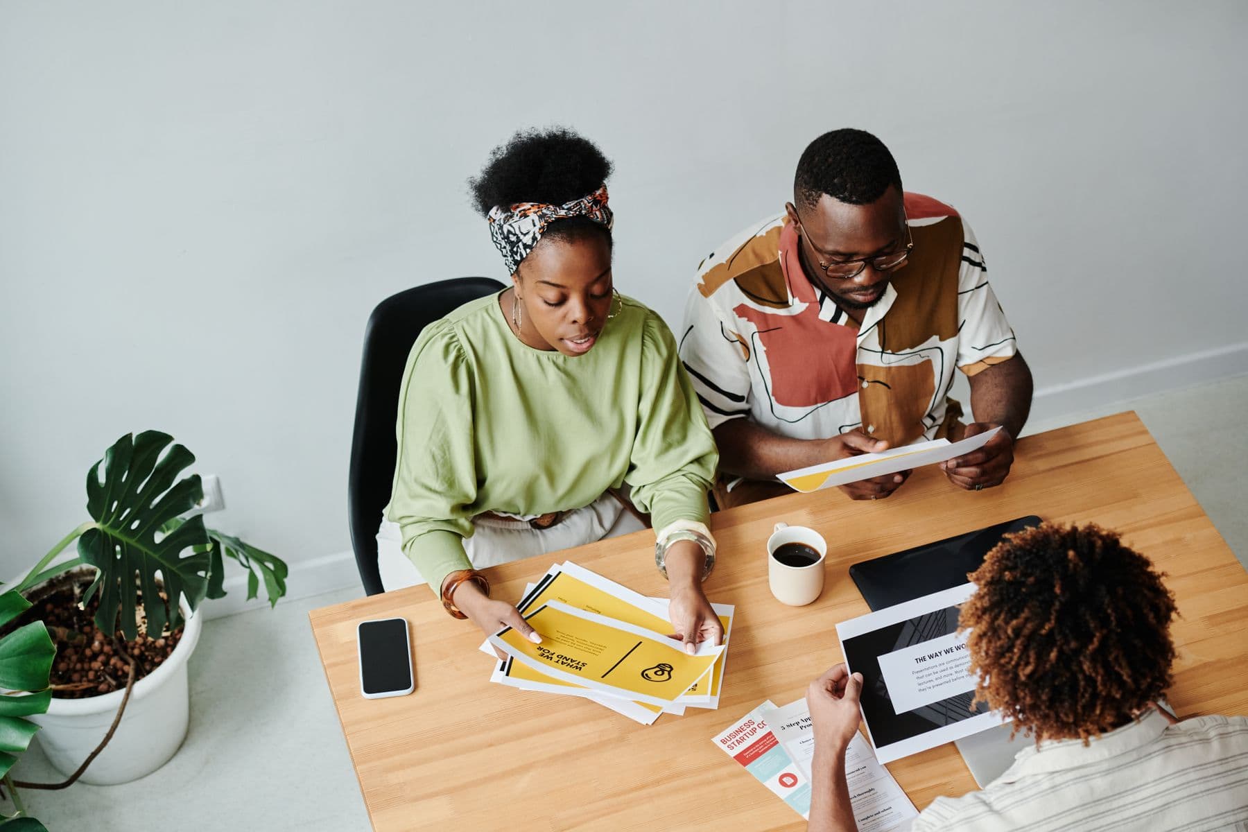 A diverse team reviewing ideas together around a table